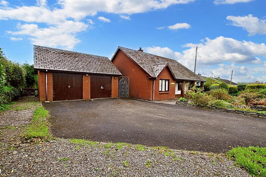 Front of house with detached garage