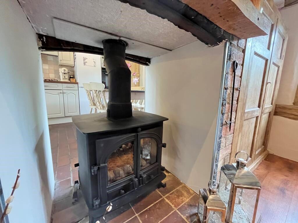 Feature wood burner between dining area and lounge