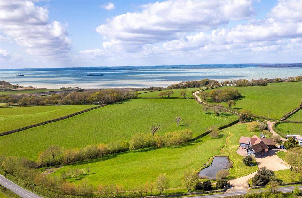 Farmhouse and nearby Thorness Bay