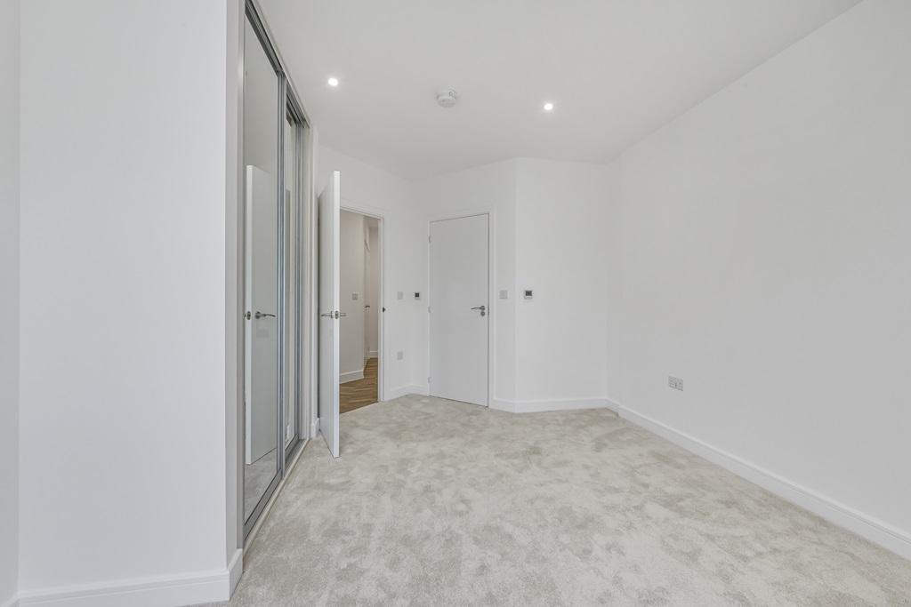 Spacious bedroom designed for modern living and...