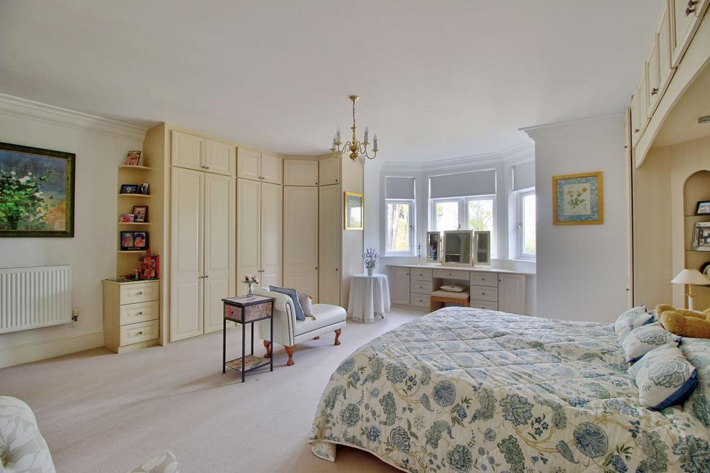 Master suite with ample storage & bay window