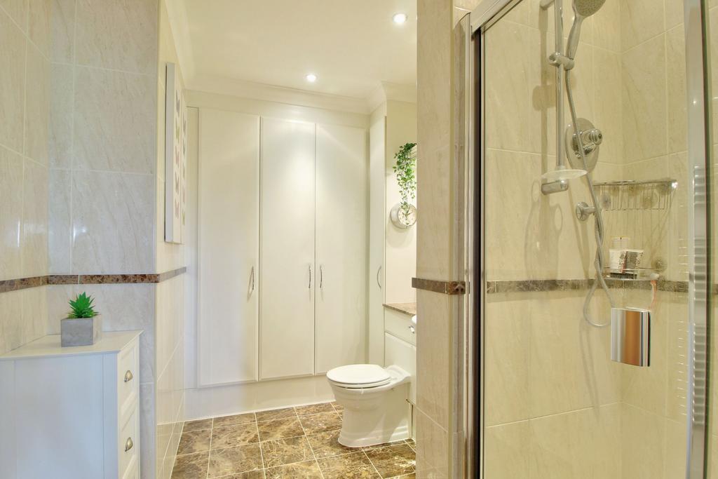 En-suite bathroom with additional storage
