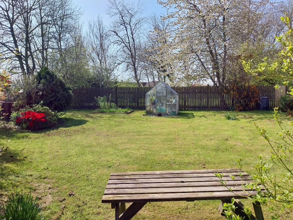 Gardens located to front of property