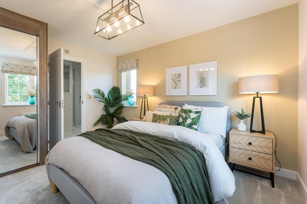 A handy en-suite bathroom sits off the main...