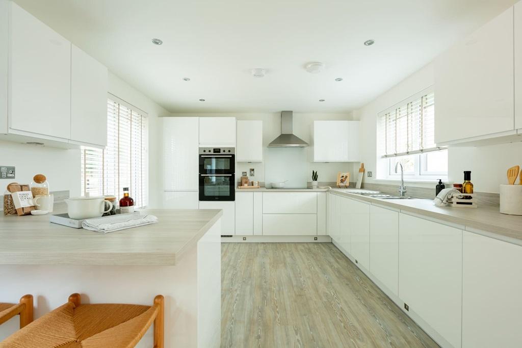 Long kitchen with ample storage and worktop...