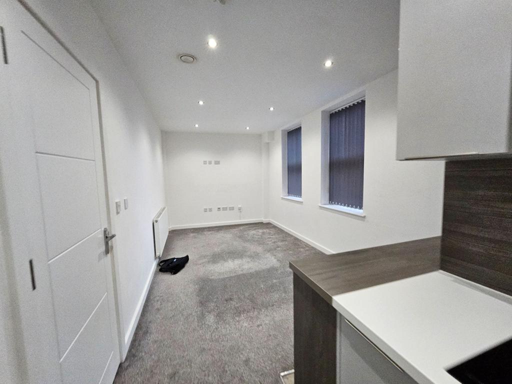 Open plan kitchen and lounge Photograph 8
