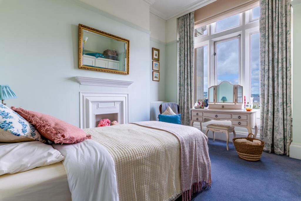 Large windows and period features in the bedroom