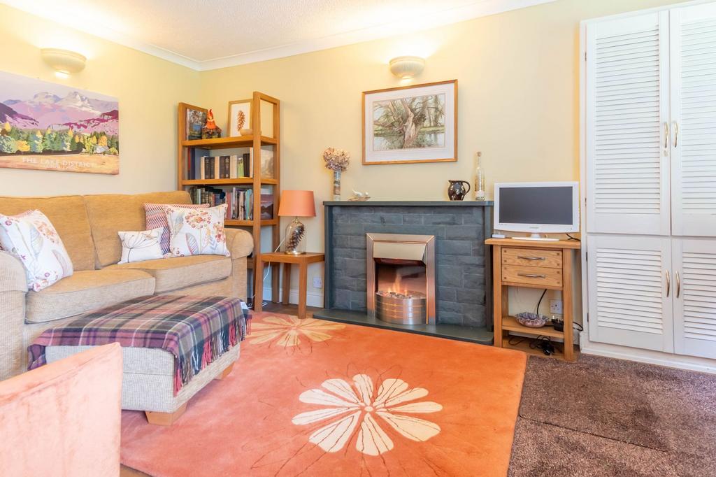 Open plan living area with kitchen off to the side