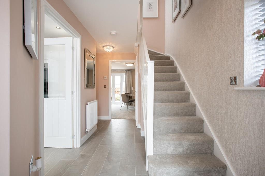 A welcoming hallway with storage cupboard