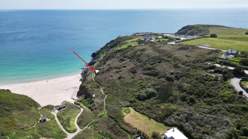 Drone photo with red arrow pointing at property