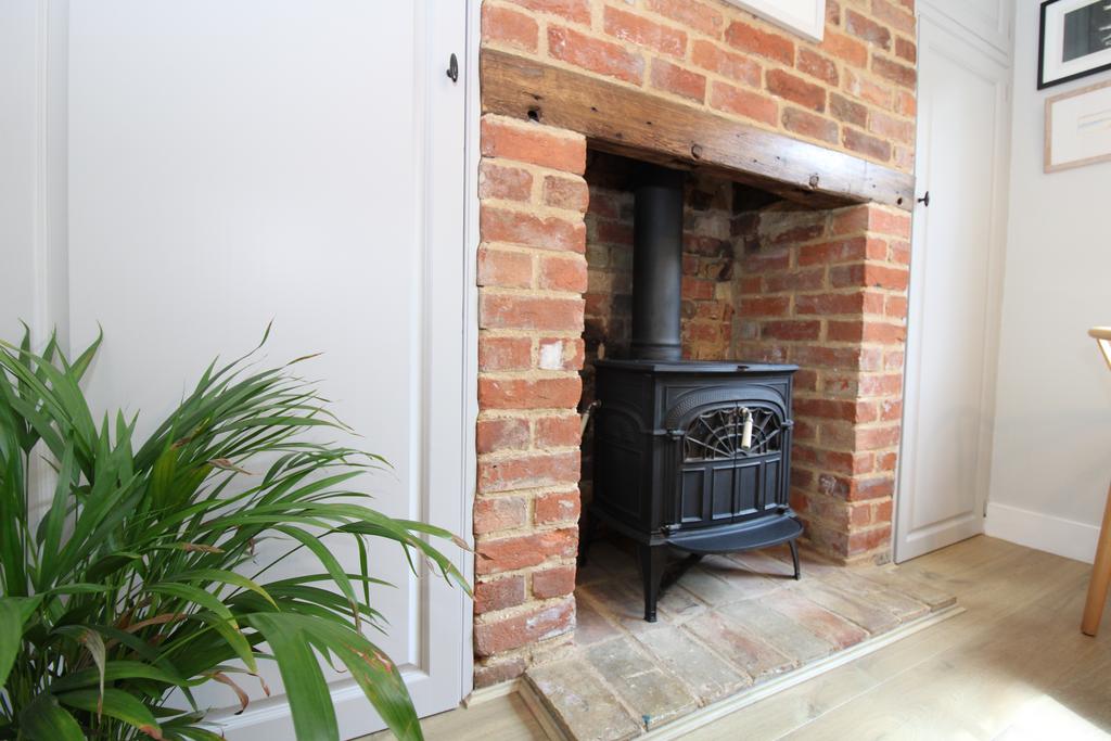 Log burning stove in dining area