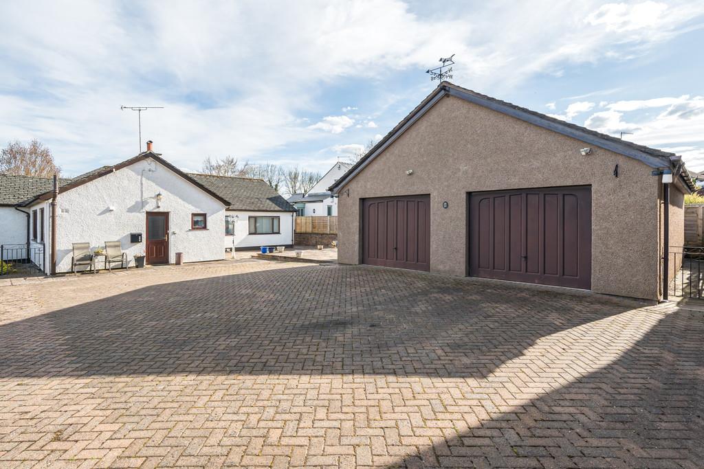 Paved Courtyard and Double Garage