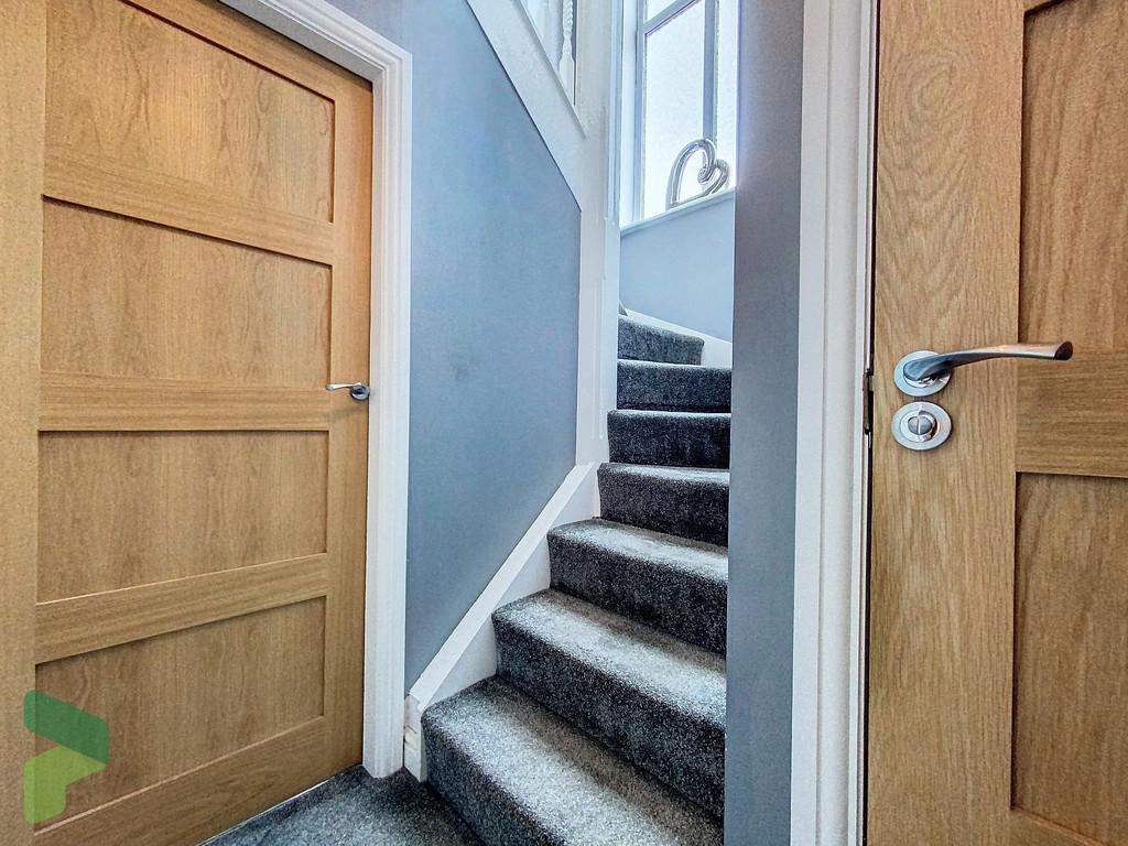 Stairs to First Floor and Fourth Bedroom