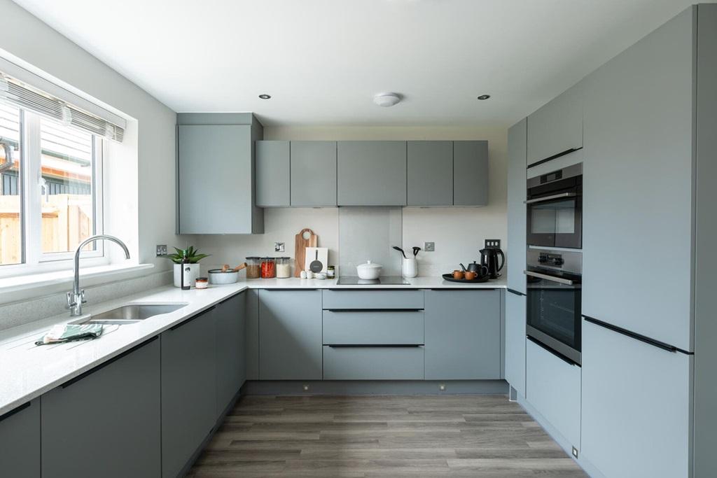 Modern kitchen with ample storage and worktop...