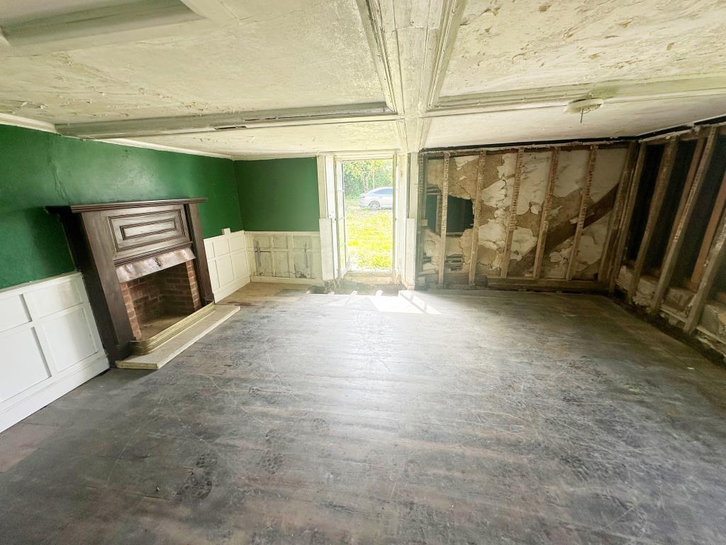 Interior room with fire place and access to side g