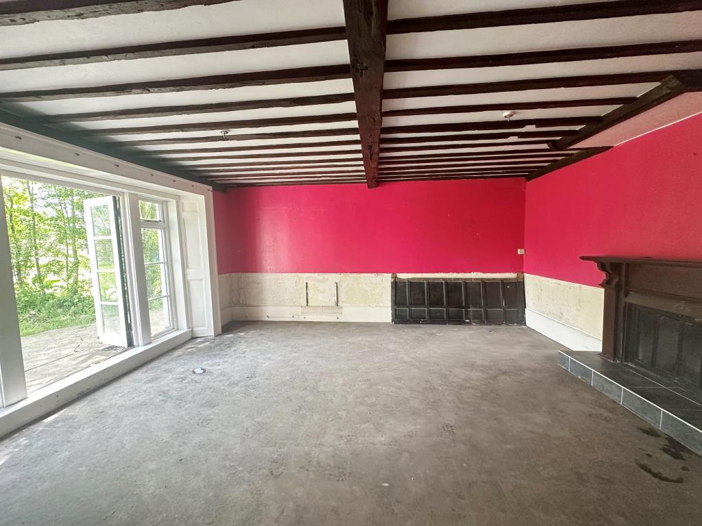 Interior room with fire place and access to rear g