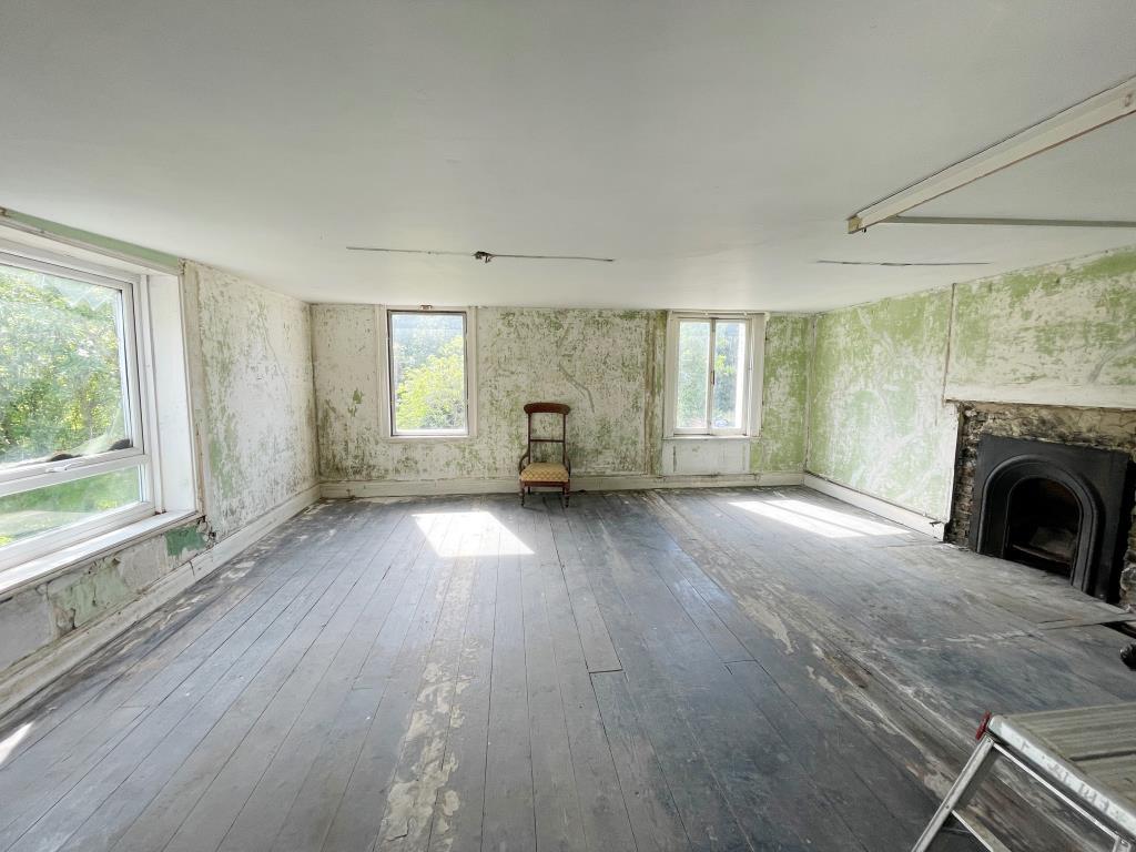 First floor bedroom with fireplace