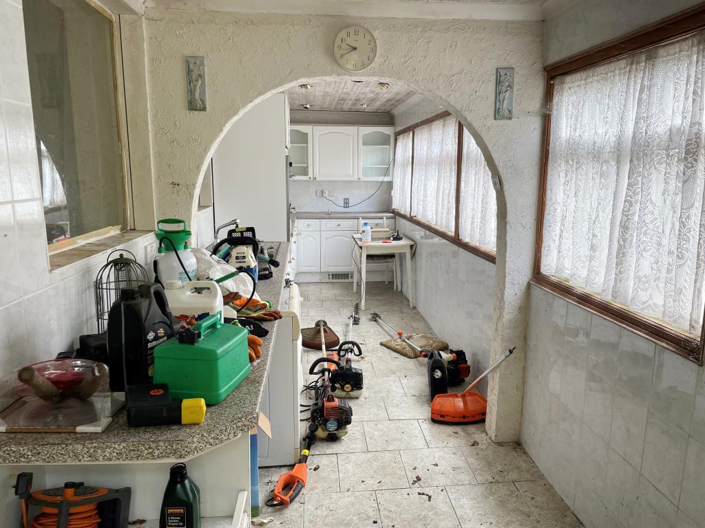 Rear kitchen with fitted units and windows