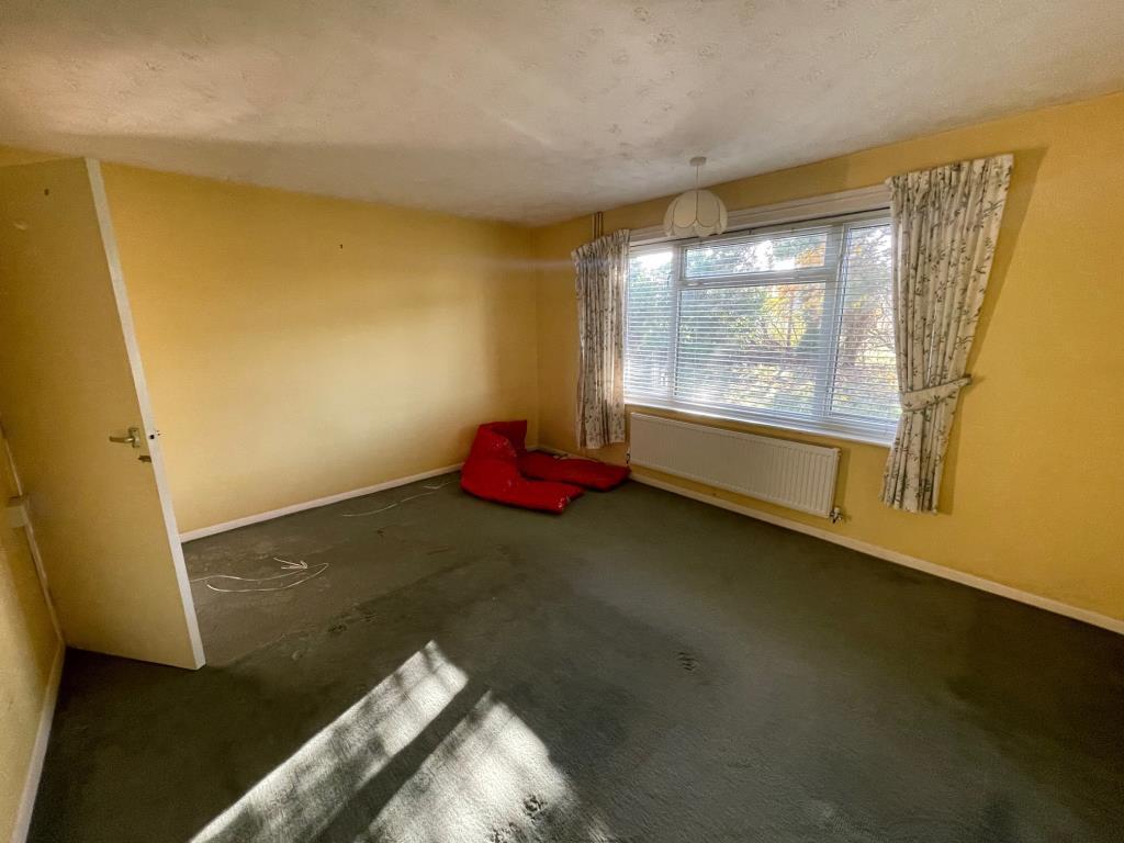 Bedroom 1 with window looking on to the garden