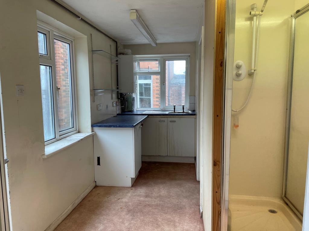 Rear kitchen with toilets and shoer unit