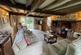 Living Room with inglenoon fireplace and exposed b