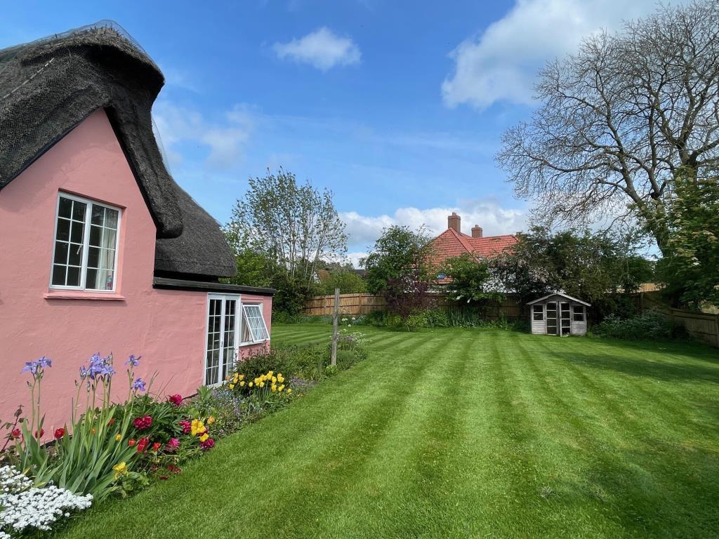 Garden to the rea of the Thatched cottage and shed