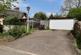 Driveway parking, double garage and shed to the re