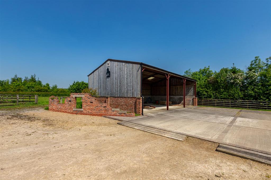 Outbuilding and Hardstanding