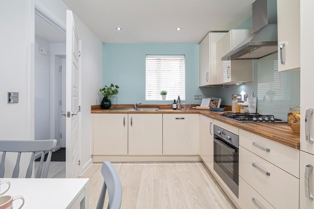 Kitchen with dining area in the Weaver 3...