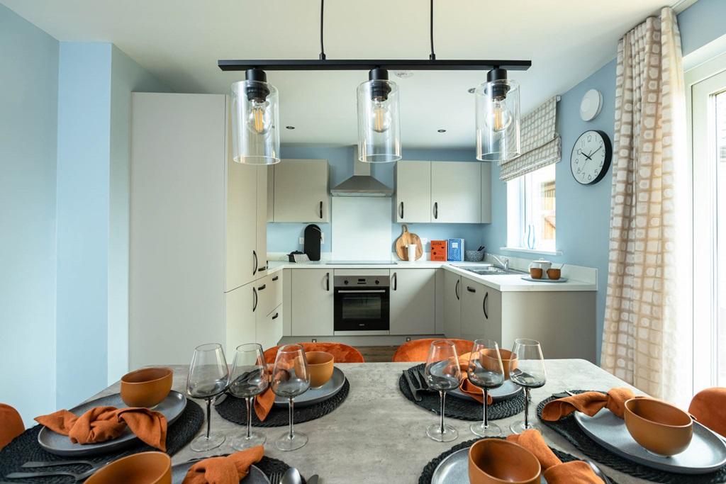 The kitchen/dining area features French doors...