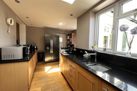 69 Rhodrons Avenue, Chessington, KT9 1AY