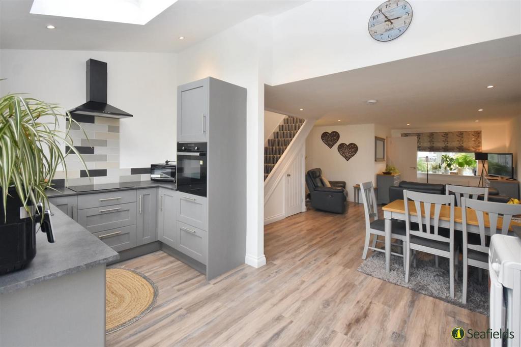 Kitchen opening to living area