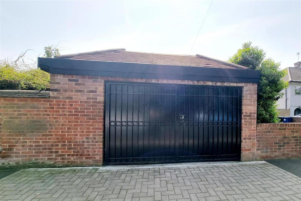 Double length garage with own drive: