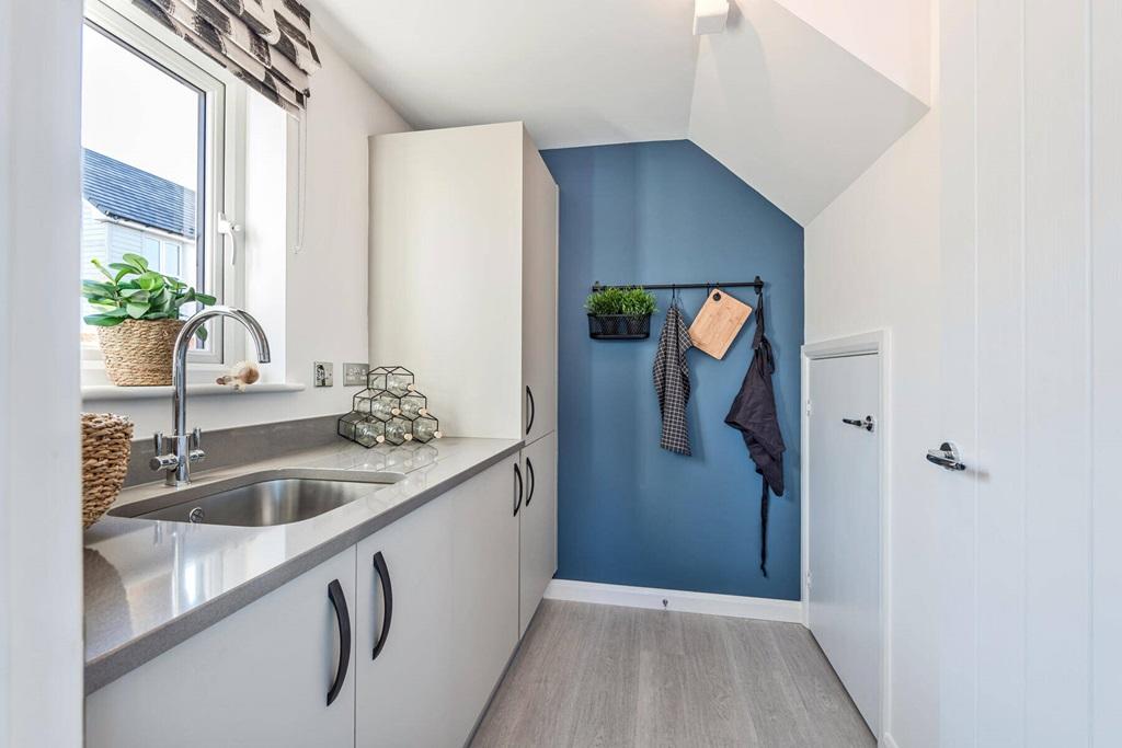 A handy utility off the kitchen for extra storage