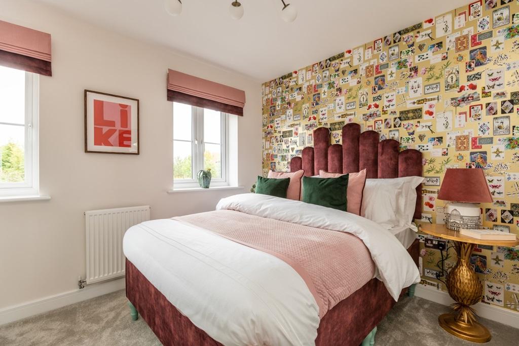 Two large windows flood the room with light