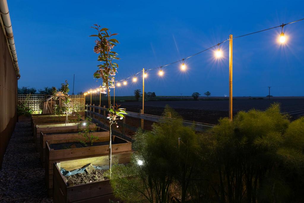 Property Boundary lit at dusk