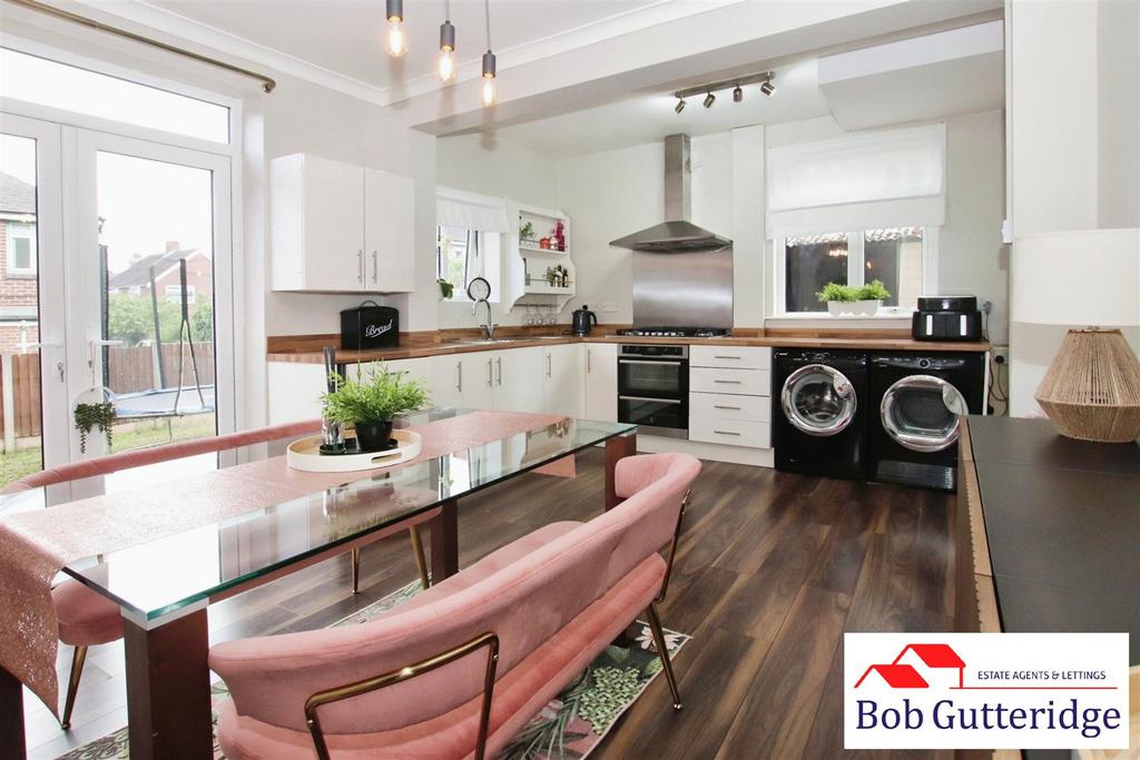 Open plan fitted kitchen / dining room