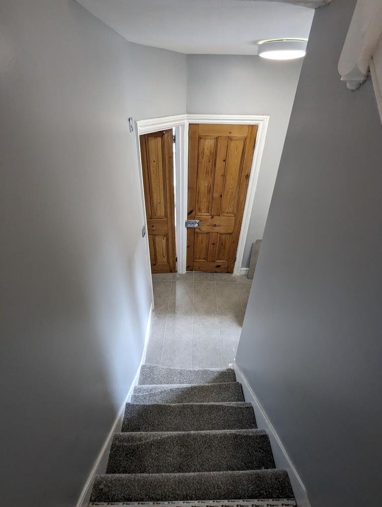 Stirs down to Bathroom and WC