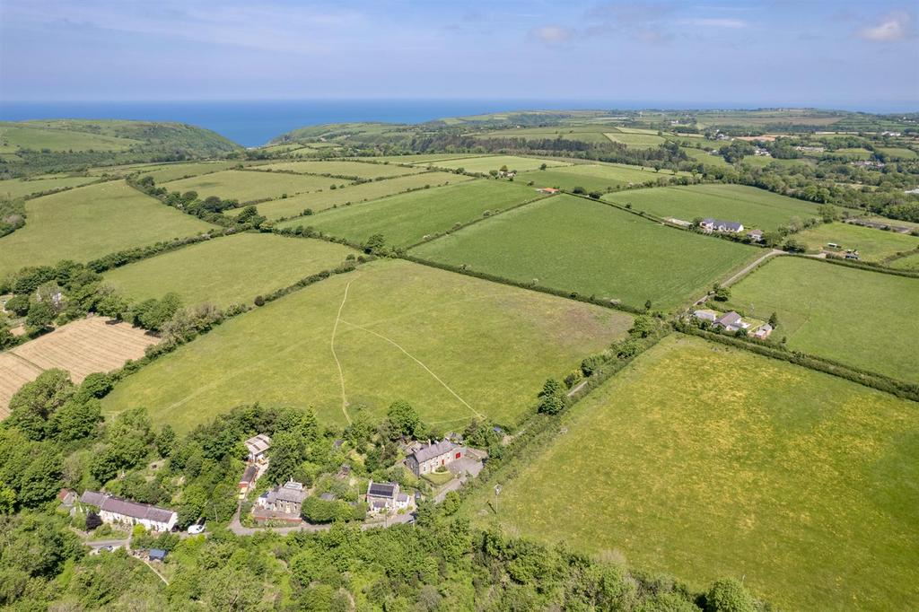 Aireal Photo of houses, land and views