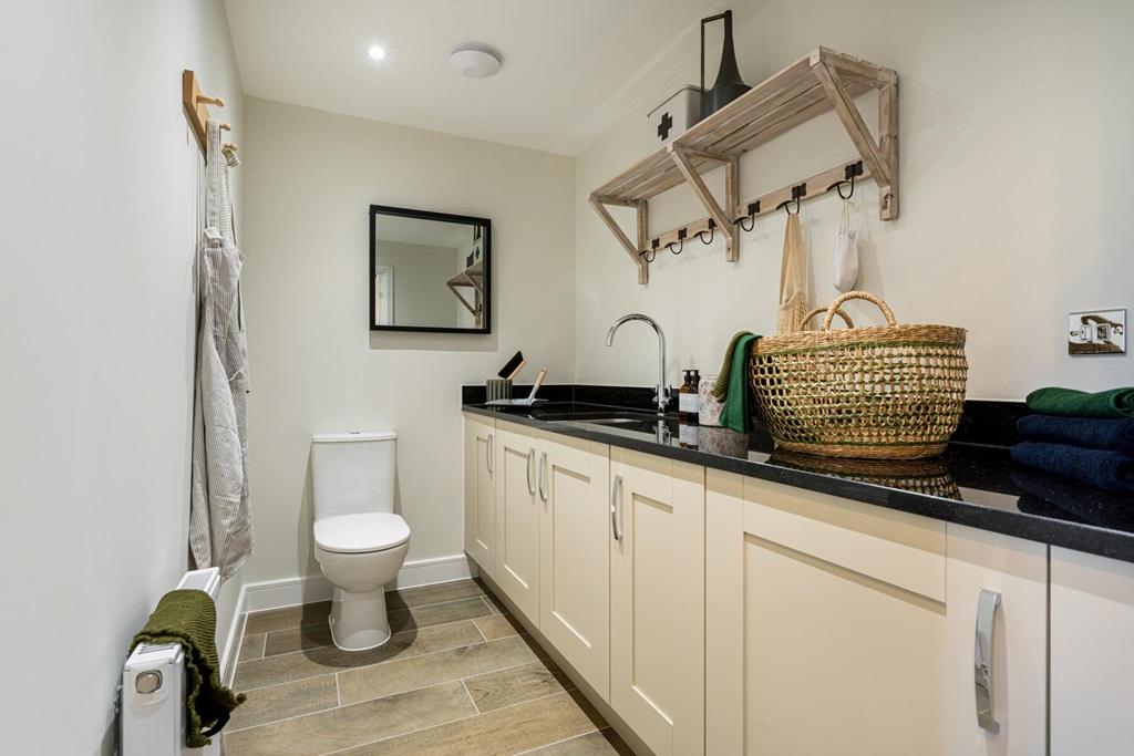 Handy cloakroom and utility room with laundry...