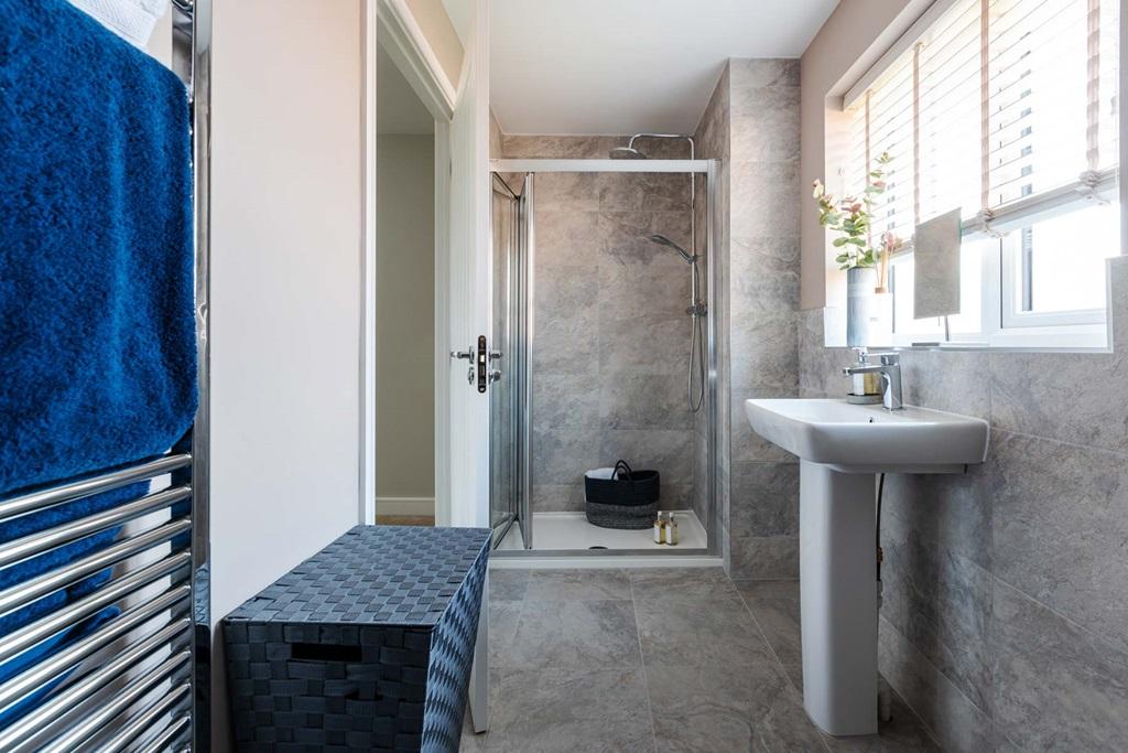 An en suite shower room to bedroom one to beat...