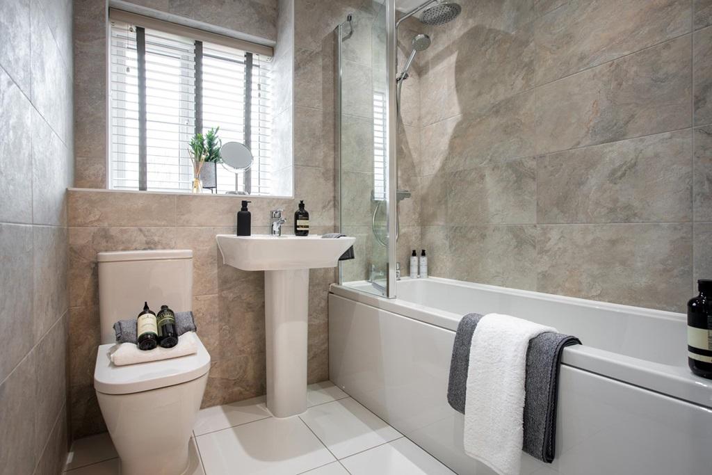 A stunning neutral bathroom invites you to relax