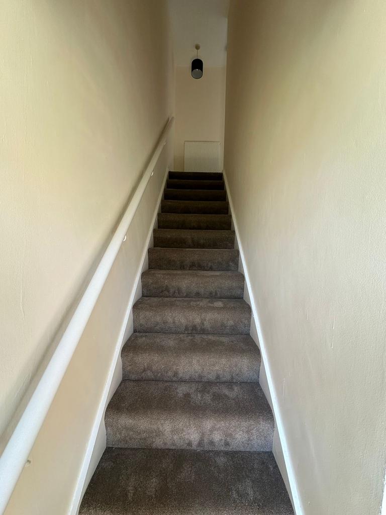 Stairs leading to Upstairs