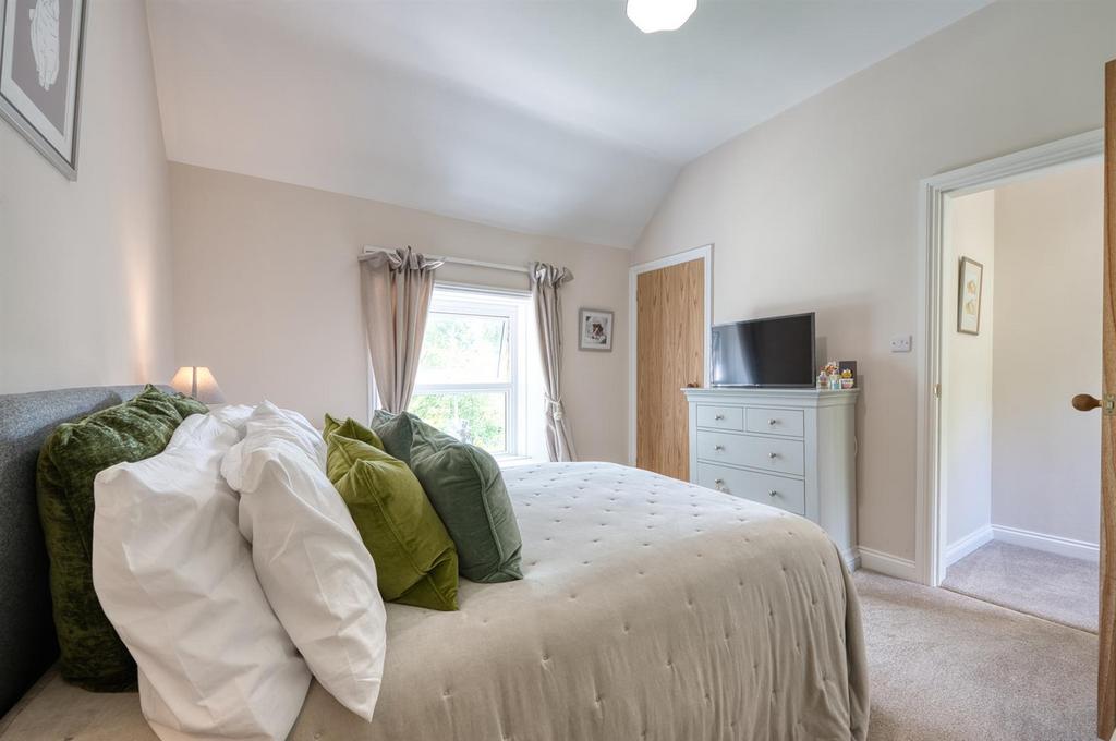 Bedroom One towards window and en-suite.jpg