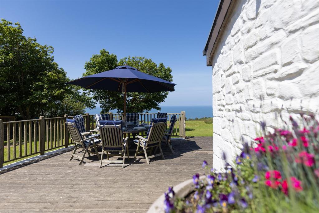 Garden and sea views from decking