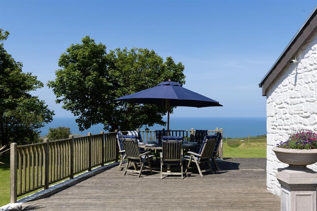 Garden and sea views from decking