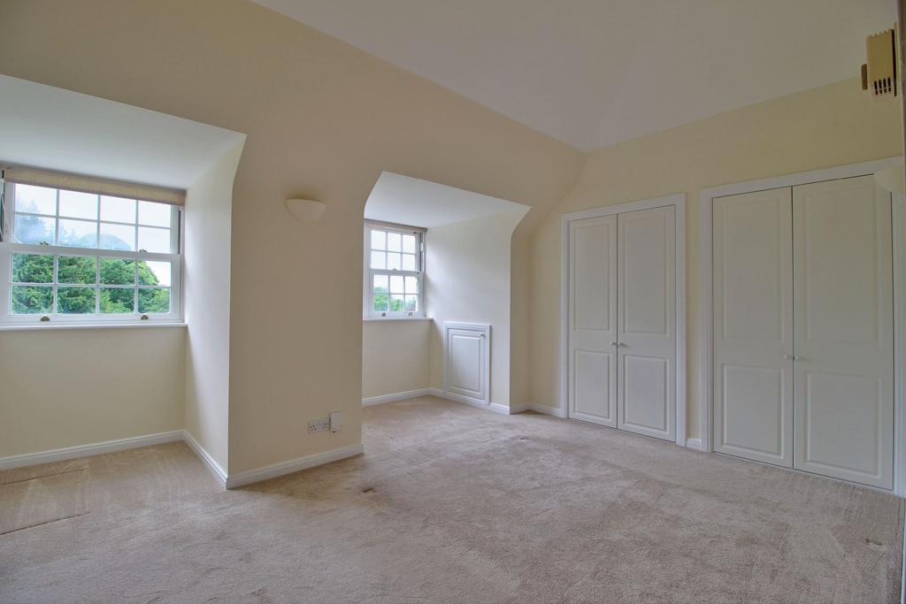 Master Bedroom with wardrobes and eaves storage ha