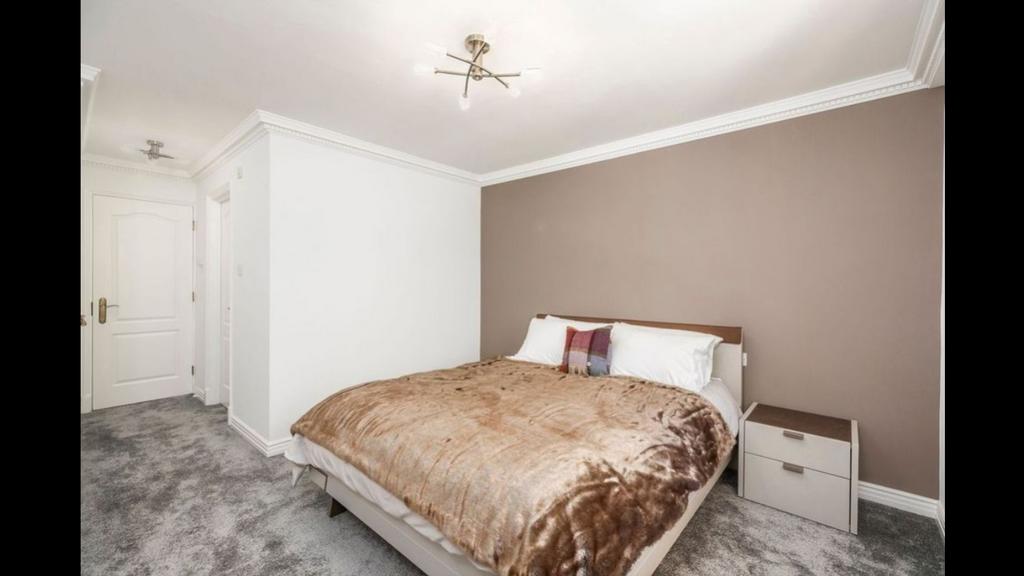 Bedroom 2 with throw