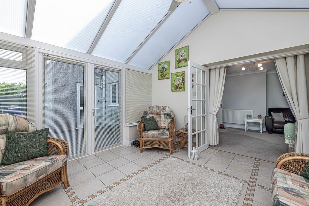 Conservatory with double door to garden