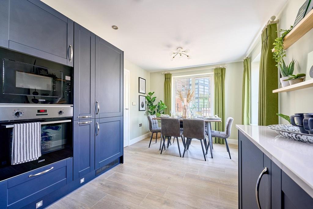 The kitchen/diner is flooded with natural light